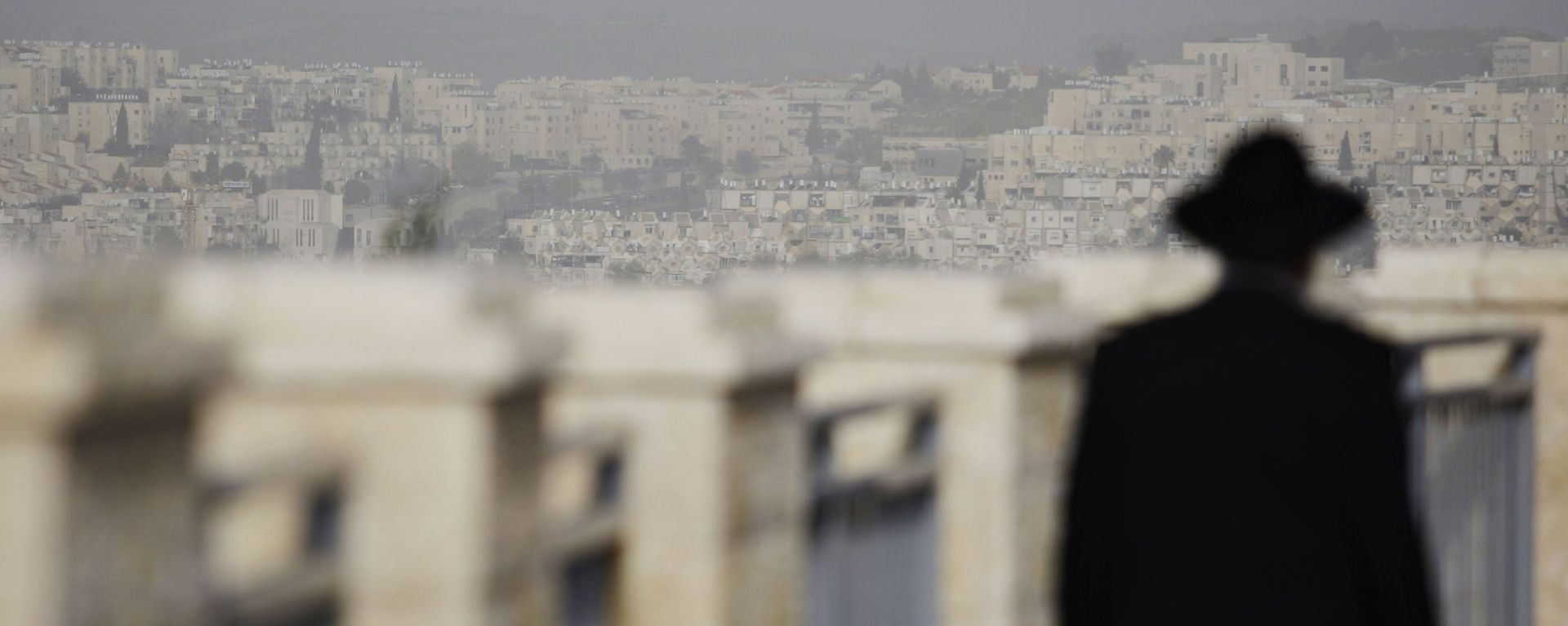 FILE -  In this Wednesday, March 10, 2010 file photo, an ultra-Orthodox Jewish man walks in the east Jerusalem neighborhood of Ramat Shlomo - Sputnik International, 1920, 12.03.2022