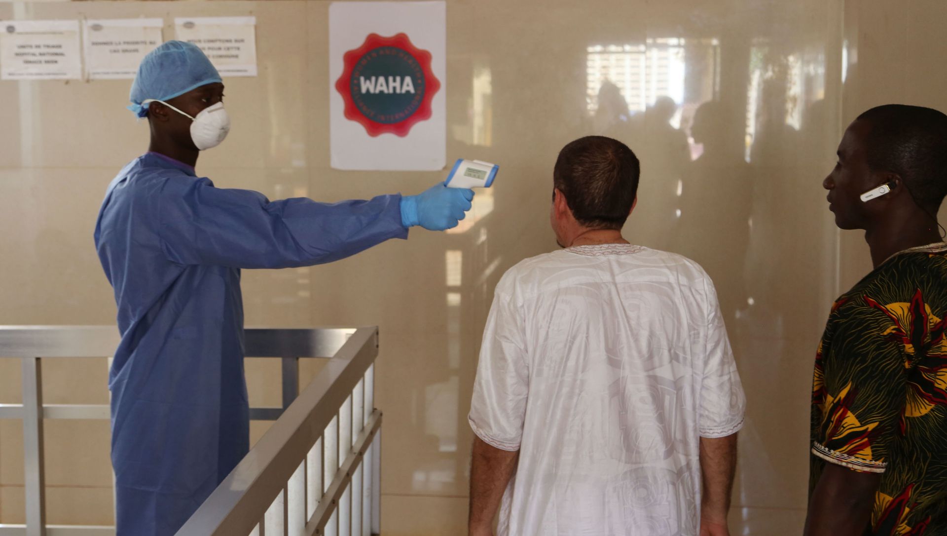 A health worker, center, takes the temperature of people to see if they might be infected by the Ebola virus inside the Ignace Deen government hospital in Conakry, Guinea, Friday March 18, 2016 A health worker, center, takes the temperature of people to see if they might be infected by the Ebola virus inside the Ignace Deen government hospital in Conakry, Guinea, Friday March 18, 2016 - Sputnik International, 1920, 15.02.2021