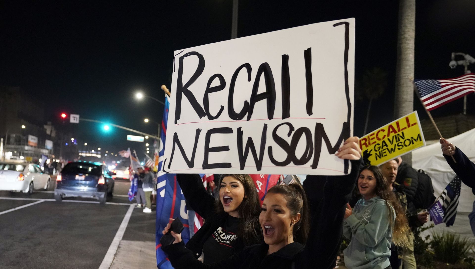 In this Nov. 21, 2020 file photo, demonstrators shout slogans while carrying a sign calling for the recall of Gov. Gavin Newsom during a protest against a stay-at-home order amid the COVID-19 pandemic in Huntington Beach, Calif In this Nov. 21, 2020 file photo, demonstrators shout slogans while carrying a sign calling for the recall of Gov. Gavin Newsom during a protest against a stay-at-home order amid the COVID-19 pandemic in Huntington Beach, Calif - Sputnik International, 1920, 16.02.2021