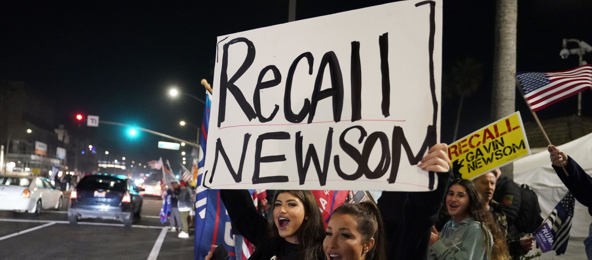 In this Nov. 21, 2020 file photo, demonstrators shout slogans while carrying a sign calling for the recall of Gov. Gavin Newsom during a protest against a stay-at-home order amid the COVID-19 pandemic in Huntington Beach, Calif In this Nov. 21, 2020 file photo, demonstrators shout slogans while carrying a sign calling for the recall of Gov. Gavin Newsom during a protest against a stay-at-home order amid the COVID-19 pandemic in Huntington Beach, Calif - Sputnik International, 1920, 16.02.2021