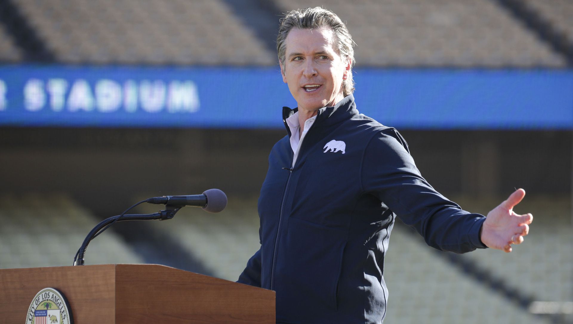 Governor Gavin Newsom addresses a press conference held at the launch of a mass COVID-19 vaccination site at Dodger Stadium on Friday, Jan. 15, 2021, in Los Angeles Governor Gavin Newsom addresses a press conference held at the launch of a mass COVID-19 vaccination site at Dodger Stadium on Friday, Jan. 15, 2021, in Los Angeles - Sputnik International, 1920, 11.03.2021