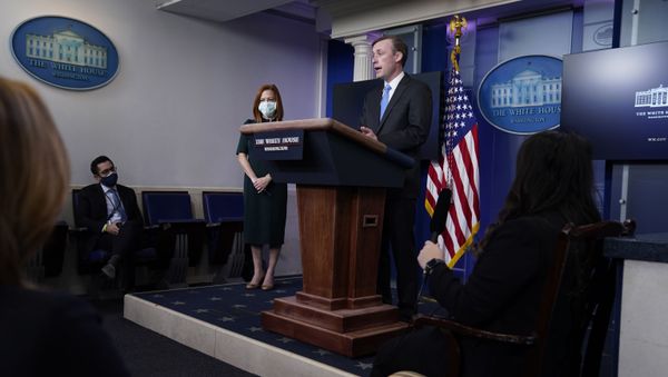 White House press secretary Jen Psaki listens as National security adviser Jake Sullivan speaks during a press briefing at the White House, Thursday, Feb. 4, 2021, in Washington. - Sputnik International