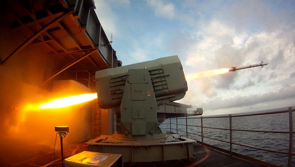 This US Navy photo obtained August 21, 2014 shows the aircraft carrier USS Theodore Roosevelt (CVN 71) as it launches a Rolling Airframe Missile (RAM) on August 19, 2014 in the Atlantic Ocean.  - Sputnik International