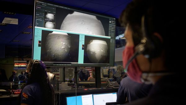 Members of NASA’s Perseverance Mars rover team watch in mission control as the first images arrive moments after the spacecraft successfully touched down on Mars, at NASA's Jet Propulsion Laboratory in Pasadena, California, U.S. February 18, 2021. - Sputnik International