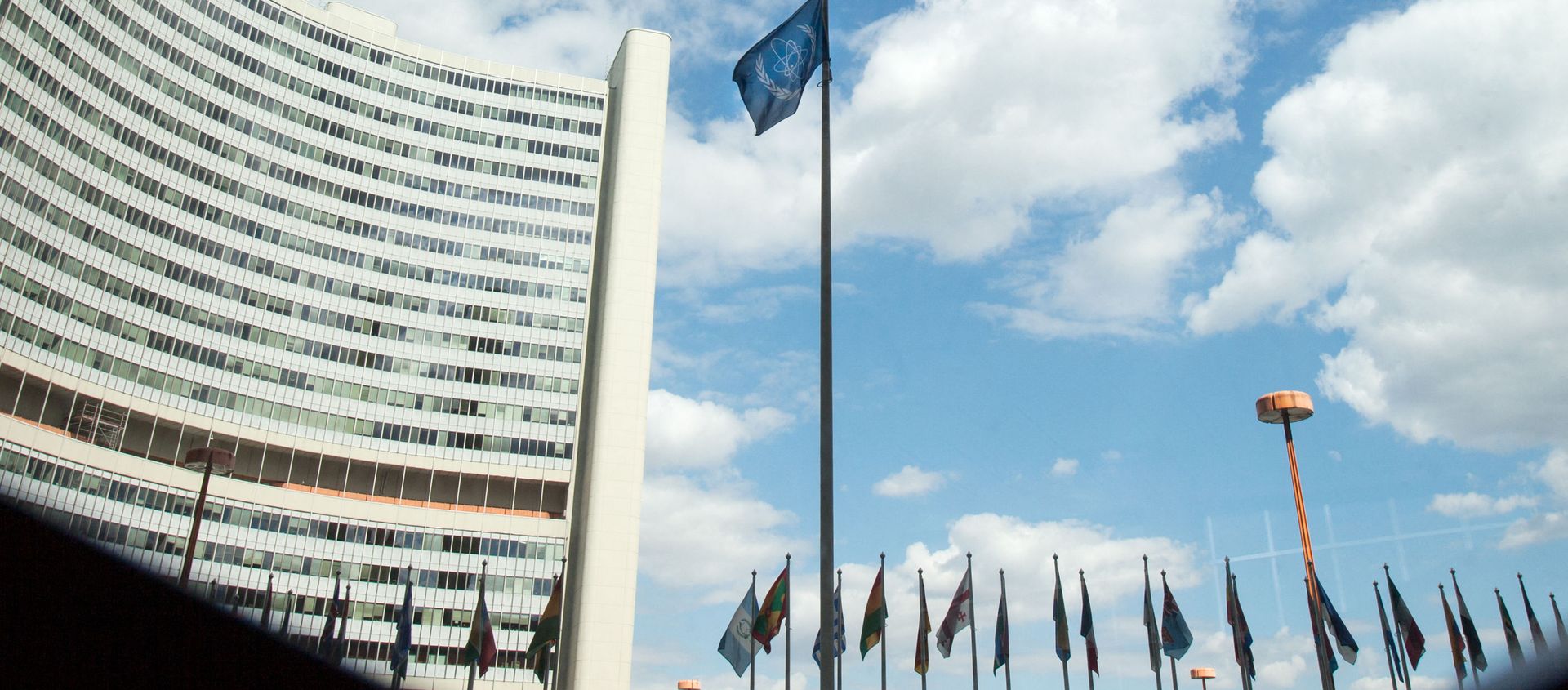 The flag of the International Atomic Energy Agency (IAEA) flutters in front of the IAEA building in Vienna on July 10, 2019. - The UN's nuclear watchdog will hold a special meeting on Iran's nuclear programme, after Tehran breached one of the limits set in a 2015 deal with world powers. The flag of the International Atomic Energy Agency (IAEA) flutters in front of the IAEA building in Vienna on July 10, 2019. - The UN's nuclear watchdog will hold a special meeting on Iran's nuclear programme, after Tehran breached one of the limits set in a 2015 deal with world powers. - Sputnik International, 1920, 20.02.2021