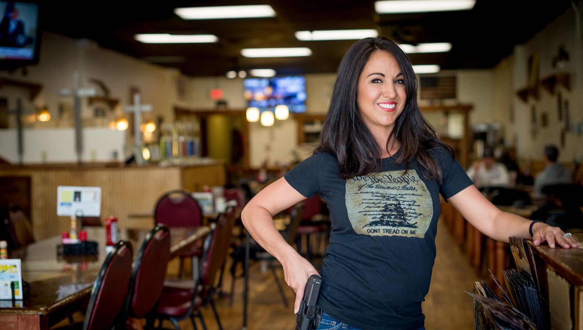 In this file photo owner Lauren Boebert poses for a portrait at Shooters Grill in Rifle, Colorado on April 24, 2018. - A Republican member of the US Congress raised eyebrows on February 18, 2021 when she appeared at a Zoom committee meeting with an arsenal of guns strategically displayed in her background. In this file photo owner Lauren Boebert poses for a portrait at Shooters Grill in Rifle, Colorado on April 24, 2018. - A Republican member of the US Congress raised eyebrows on February 18, 2021 when she appeared at a Zoom committee meeting with an arsenal of guns strategically displayed in her background. - Sputnik International, 1920, 19.02.2021