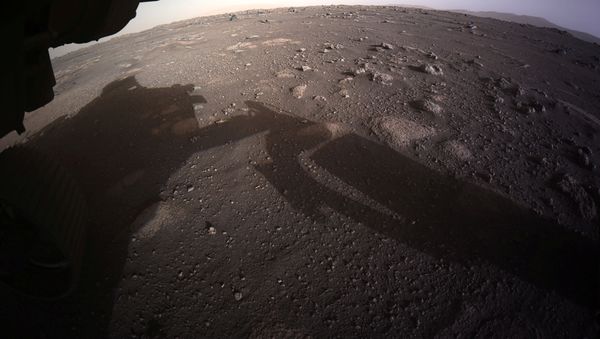 The first high-resolution, color image to be sent back by the Hazard Cameras (Hazcams) on the underside of NASA's Perseverance Mars rover is seen after its landing on Mars February 18, 2021. - Sputnik International