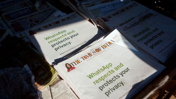 A WhatsApp advertisement is seen on the front pages of newspapers at a stall in Mumbai, India, January 13, 2021. - Sputnik International