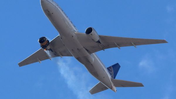 United Airlines flight UA328, carrying 231 passengers and 10 crew on board, returns to Denver International Airport with its starboard engine on fire after it called a Mayday alert, over Denver, Colorado, U.S. February 20, 2021. - Sputnik International