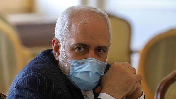 Iran's Foreign Minister Mohammad Javad Zarif looks on during a meeting with International Atomic Energy Agency (IAEA) Director General Rafael Grossi in Tehran, Iran February 21, 2021. - Sputnik International