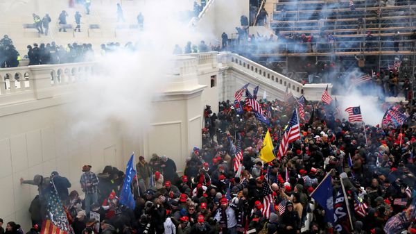 Police release tear gas into a crowd of pro-Trump protesters during clashes at a rally to contest the certification of the 2020 U.S. presidential election results by the U.S. Congress, at the U.S. Capitol Building in Washington, U.S, January 6, 2021. - Sputnik International