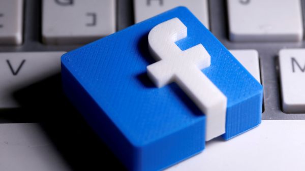 A 3D-printed Facebook logo is seen placed on a keyboard in this illustration taken March 25, 2020.  - Sputnik International