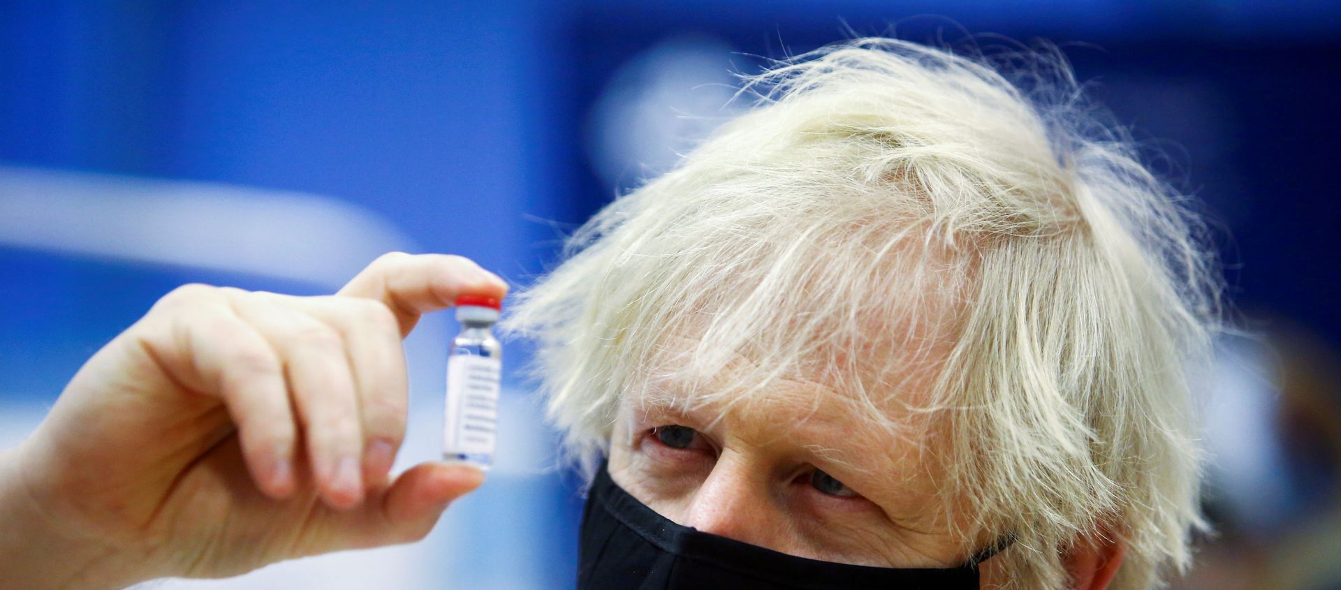 FILE PHOTO: Britain's Prime Minister Boris Johnson holds a vial of an Oxford-AstraZeneca COVID-19 vaccine, during his visit at a vaccination centre at Cwmbran Stadium in Cwmbran, south Wales, Britain February 17, 2021. Geoff Caddick/Pool via REUTERS/File Photo FILE PHOTO: Britain's Prime Minister Boris Johnson holds a vial of an Oxford-AstraZeneca COVID-19 vaccine, during his visit at a vaccination centre at Cwmbran Stadium in Cwmbran, south Wales, Britain February 17, 2021. Geoff Caddick/Pool via REUTERS/File Photo - Sputnik International, 1920, 23.02.2021