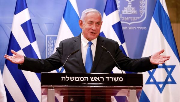 Israeli Prime Minister Benjamin Netanyahu speaks at a news conference next to Greek Prime Minister Kyriakos Mitsotakis (not pictured) after their meeting in the PM's office in Jerusalem February 8, 2021 - Sputnik International