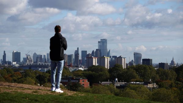 FILE PHOTO: A person looks at the skyline of central London in the background, amid the outbreak of the coronavirus disease (COVID-19), in London, Britain October 15, 2020. REUTERS/Hannah McKay/File Photo - Sputnik International