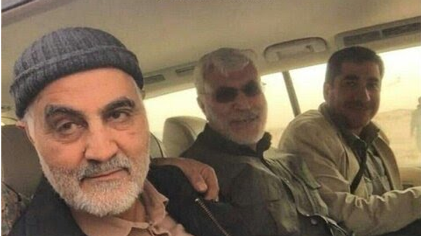 Qasem Soleimani (left) pictured alongside Iraqi Shia militia leader Abu Mahdi al-Muhandis (center). - Sputnik International