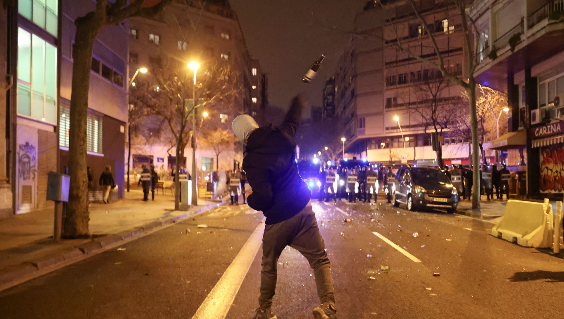 A demonstrator throws a bottle towards police during a protest in support of rap singer Pablo Hasel, after he was given a jail sentence on charges of glorifying terrorism and insulting royalty in his songs, in Barcelona, Spain, February 23, 2021 A demonstrator throws a bottle towards police during a protest in support of rap singer Pablo Hasel, after he was given a jail sentence on charges of glorifying terrorism and insulting royalty in his songs, in Barcelona, Spain, February 23, 2021 - Sputnik International, 1920, 24.02.2021