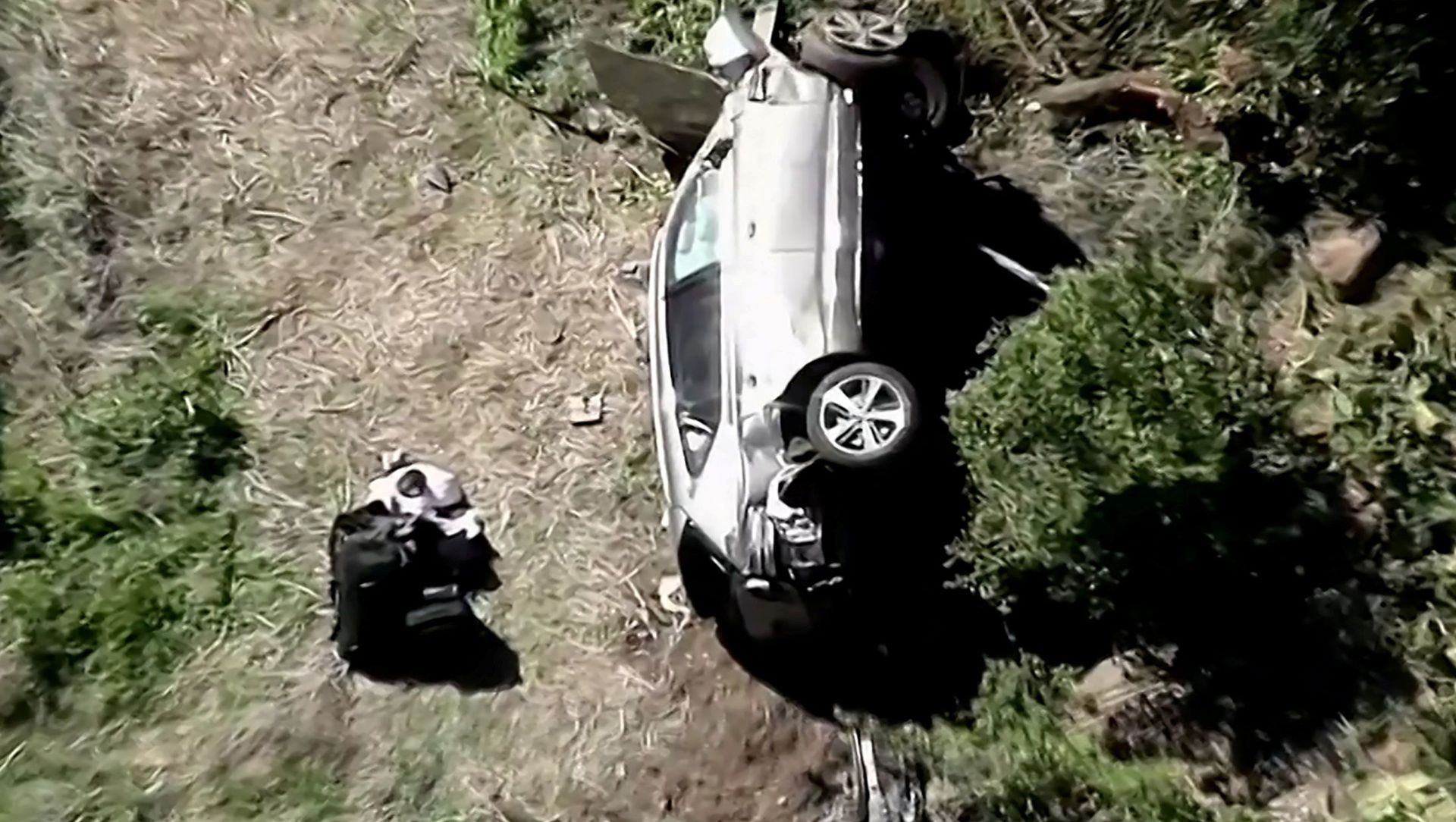 The vehicle of golfer Tiger Woods, who was rushed to hospital after suffering multiple injuries, lies on its side after being involved in a single-vehicle accident in Los Angeles, California, U.S. in a still image from video taken February 23, 2021 The vehicle of golfer Tiger Woods, who was rushed to hospital after suffering multiple injuries, lies on its side after being involved in a single-vehicle accident in Los Angeles, California, U.S. in a still image from video taken February 23, 2021 - Sputnik International, 1920, 24.02.2021