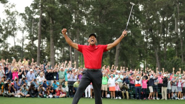 FILE PHOTO: Golf - Masters - Augusta National Golf Club - Augusta, Georgia, U.S. - April 14, 2019. Tiger Woods of the U.S. celebrates on the 18th hole to win the 2019 Masters. - Sputnik International