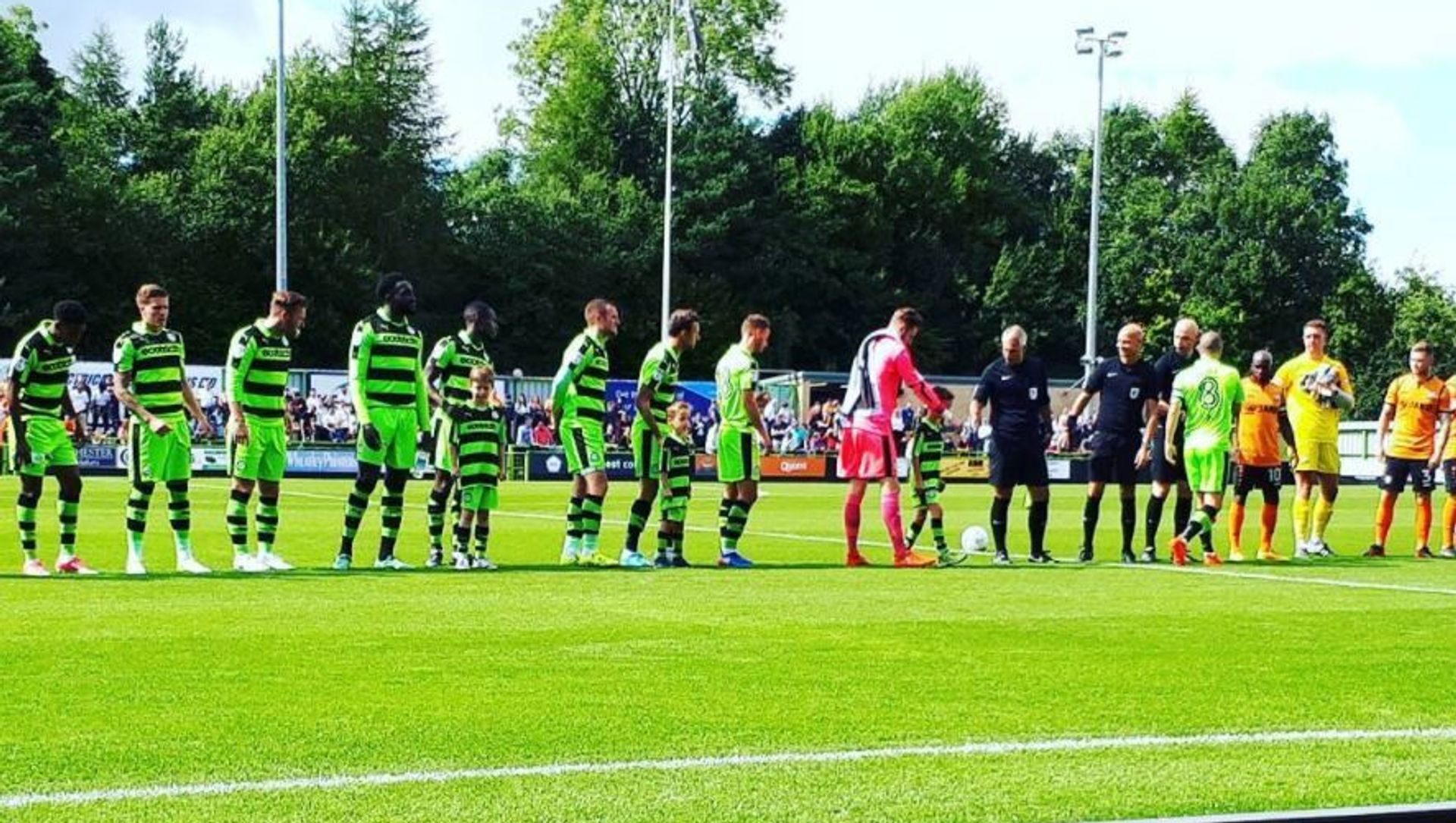 Forest Green Rovers players line up ahead of a match at their stadium in England Forest Green Rovers players line up ahead of a match at their stadium in England - Sputnik International, 1920, 26.02.2021