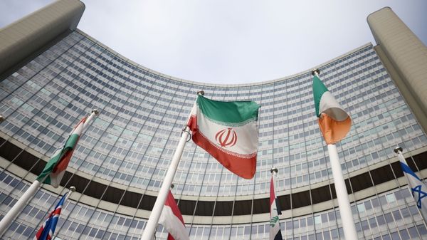 The Iranian flag waves in front of the International Atomic Energy Agency (IAEA) headquarters, amid the coronavirus disease (COVID-19) outbreak in Vienna, Austria, March 1, 2021. REUTERS/Lisi Niesner - Sputnik International