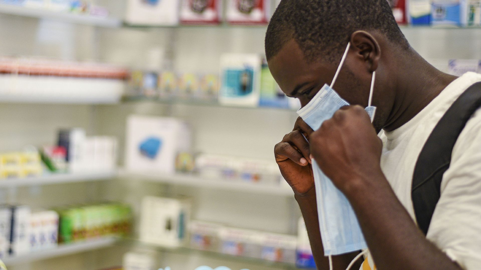 FILE — In this Feb. 6, 2020, file photo, a man tries on a face mask at a pharmacy in Kitwe, Zambia. Facing financial difficulties aggravated by the coronavirus pandemic, the southern African nation of Zambia seems to be headed for a default on debt owed to private investors FILE — In this Feb. 6, 2020, file photo, a man tries on a face mask at a pharmacy in Kitwe, Zambia. Facing financial difficulties aggravated by the coronavirus pandemic, the southern African nation of Zambia seems to be headed for a default on debt owed to private investors - Sputnik International, 1920, 01.03.2021