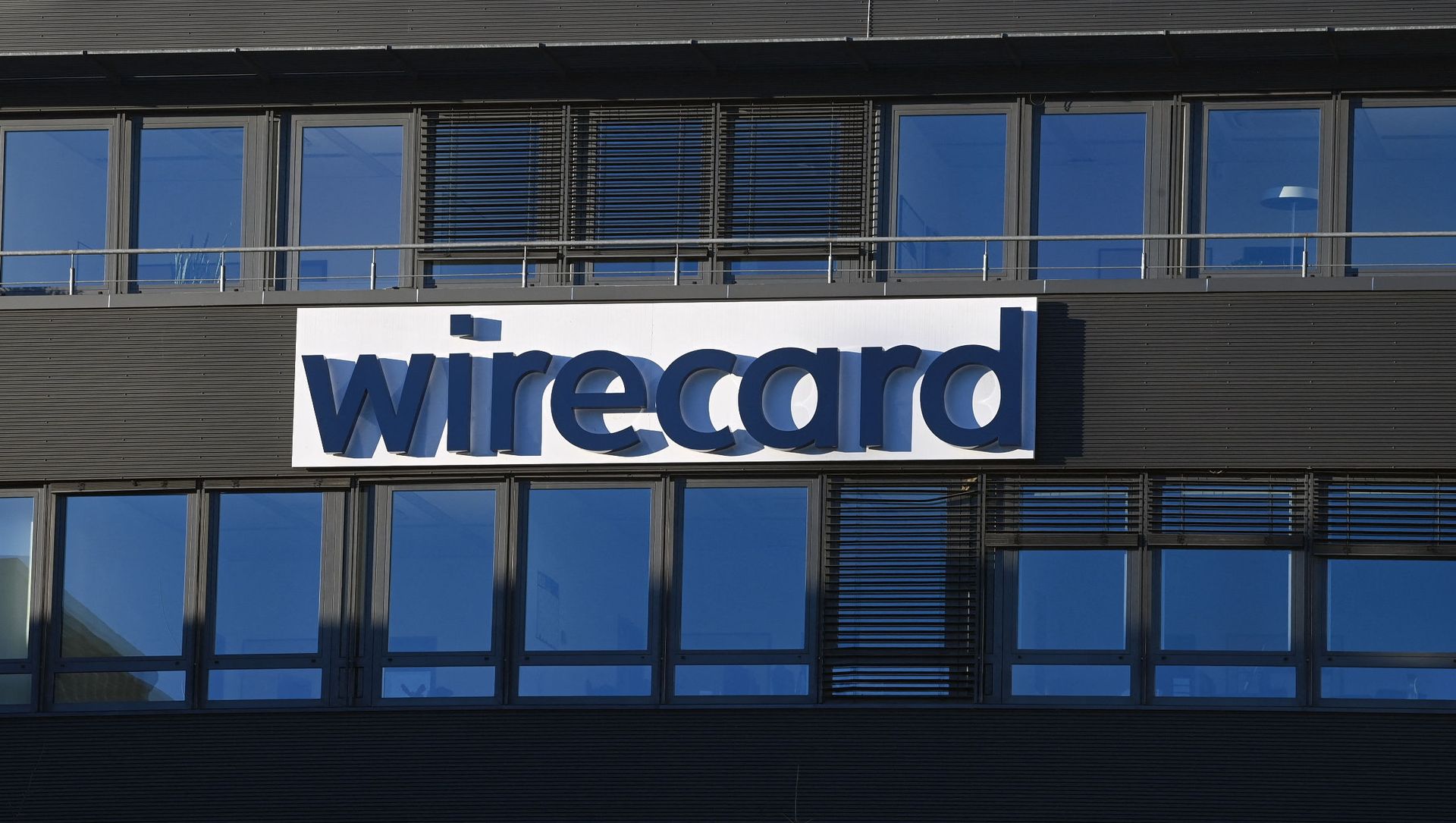 The logo of German payments provider Wirecard is seen at a building of the company's headquarters in Aschheim near Munich, southern Germany, on November 18, 2020 as the first creditors' event after the financial scandal takes place in Munich. The logo of German payments provider Wirecard is seen at a building of the company's headquarters in Aschheim near Munich, southern Germany, on November 18, 2020 as the first creditors' event after the financial scandal takes place in Munich. - Sputnik International, 1920, 01.03.2021