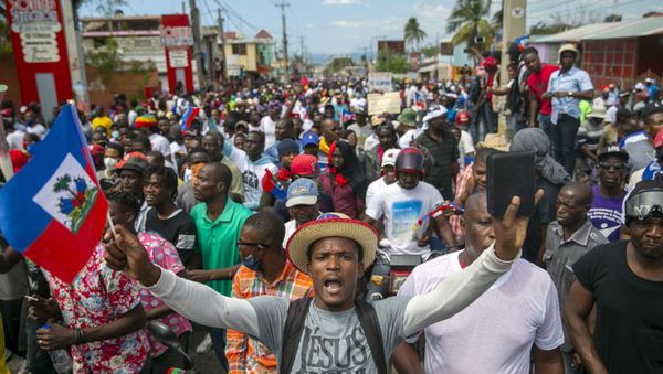 People protest to demand the resignation of Haitian President Jovenel Moise in Port-au-Prince, Haiti, Sunday, Feb. 28, 2021. The opposition is disputing the mandate of President Moise whose term they claim ended on Feb. 7, but the president and his supporters say his five-year term only expires in 2022. - Sputnik International