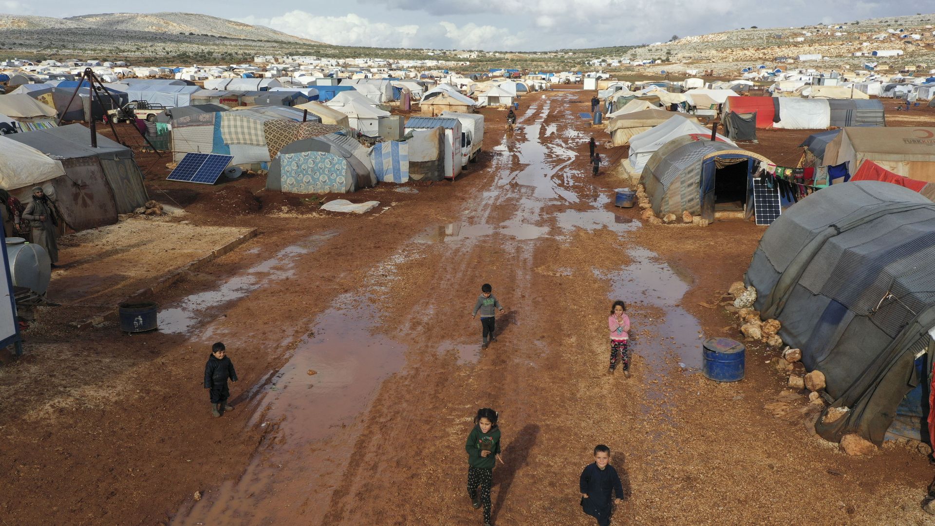 Syrian refugees walk through a camp for displaced muddied by recent rains near the village of Kafr Aruq , in Idlib province, Syria, Thursday, Jan. 28, 2021. Syrian refugees walk through a camp for displaced muddied by recent rains near the village of Kafr Aruq , in Idlib province, Syria, Thursday, Jan. 28, 2021. - Sputnik International, 1920, 02.03.2021
