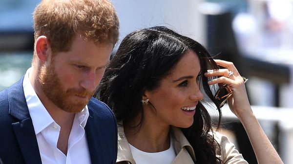 (FILES) In this file photo Britain's Prince Harry and wife Meghan arrive for a public walk at the Sydney Opera House in Sydney on 16 October 2018 - Sputnik International
