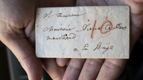 Unopened letterpacket DB-1627 was virtually unfolded and read for the first time. An Unlocking History Research Group team member holds the packet in their hands to show its small size. Brienne Collection, Sound and Vision The Hague, The Netherlands. - Sputnik International