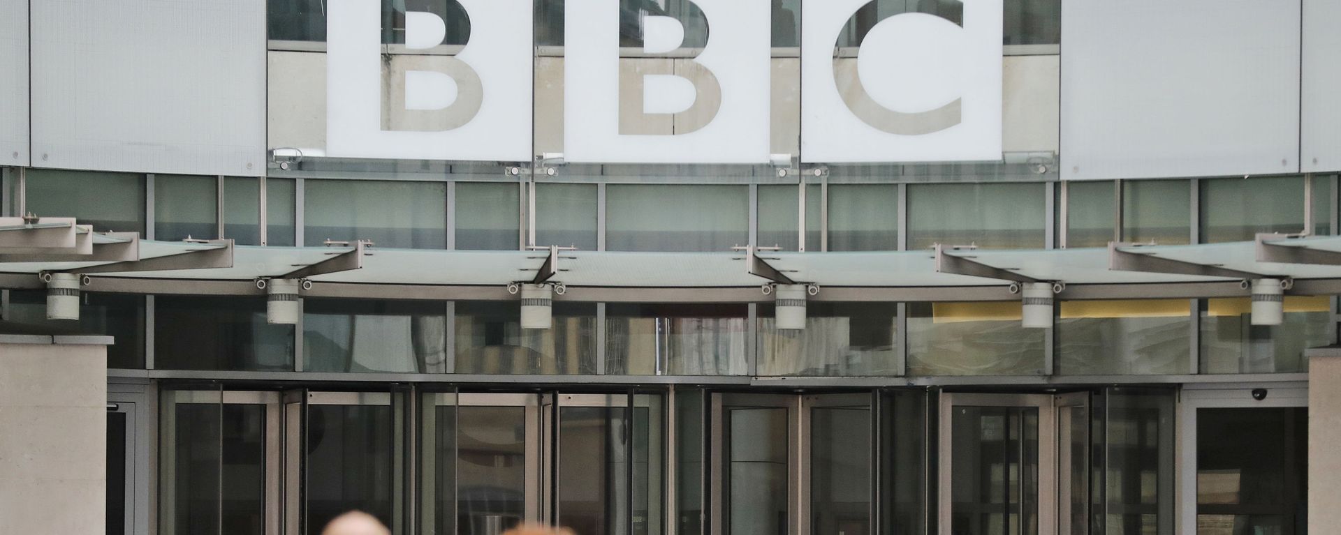 In this file photo dated Wednesday, July 19, 2017, an entrance to the headquarters of the publicly funded BBC in London. Britain’s government announced Wednesday Feb. 5, 2020, that it is considering a change in the way the nation's public broadcaster, the BBC is funded In this file photo dated Wednesday, July 19, 2017, an entrance to the headquarters of the publicly funded BBC in London. Britain’s government announced Wednesday Feb. 5, 2020, that it is considering a change in the way the nation's public broadcaster, the BBC is funded - Sputnik International, 1920, 21.05.2021