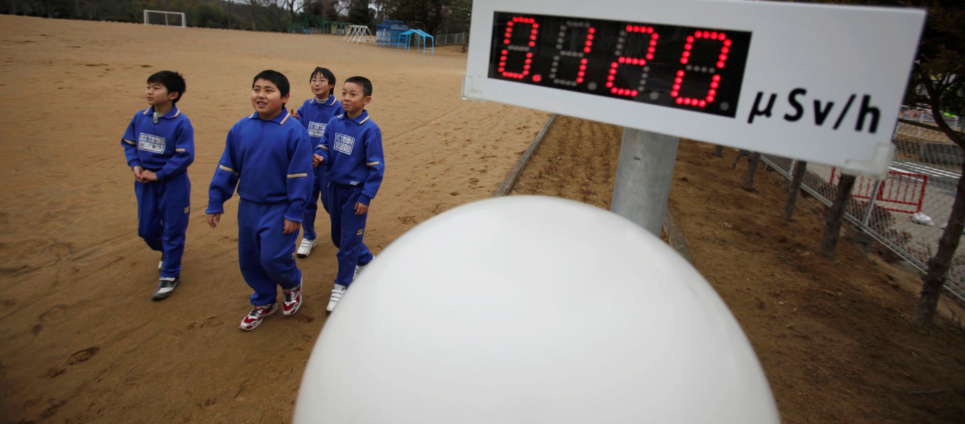 FILE PHOTO: Students walk near a geiger counter, measuring a radiation level of 0.12 microsievert per hour, at Omika Elementary School, located about 21 km (13 miles) from the tsunami-crippled Fukushima Daiichi nuclear power plant, in Minamisoma, Fukushima prefecture, March 8, 2012, ahead of the first anniversary of the March 11 earthquake and tsunami. FILE PHOTO: Students walk near a geiger counter, measuring a radiation level of 0.12 microsievert per hour, at Omika Elementary School, located about 21 km (13 miles) from the tsunami-crippled Fukushima Daiichi nuclear power plant, in Minamisoma, Fukushima prefecture, March 8, 2012, ahead of the first anniversary of the March 11 earthquake and tsunami. - Sputnik International, 1920, 11.03.2021