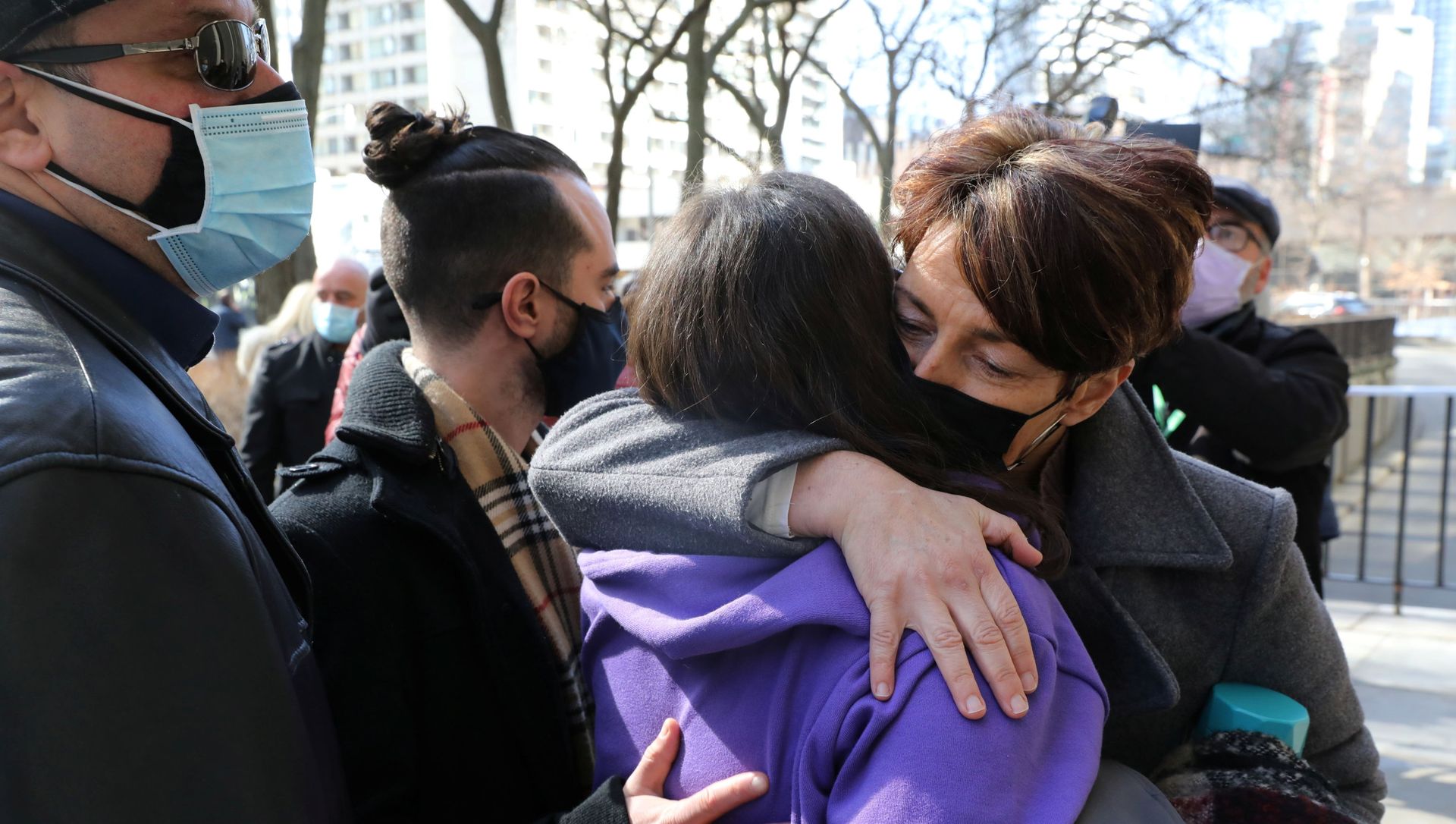Relatives of those who died when Alex Minassian drove a van into a crowd of shoppers in Toronto in 2018 hug outside court Relatives of those who died when Alex Minassian drove a van into a crowd of shoppers in Toronto in 2018 hug outside court - Sputnik International, 1920, 04.03.2021
