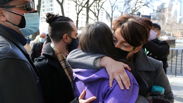 Relatives of those who died when Alex Minassian drove a van into a crowd of shoppers in Toronto in 2018 hug outside court - Sputnik International