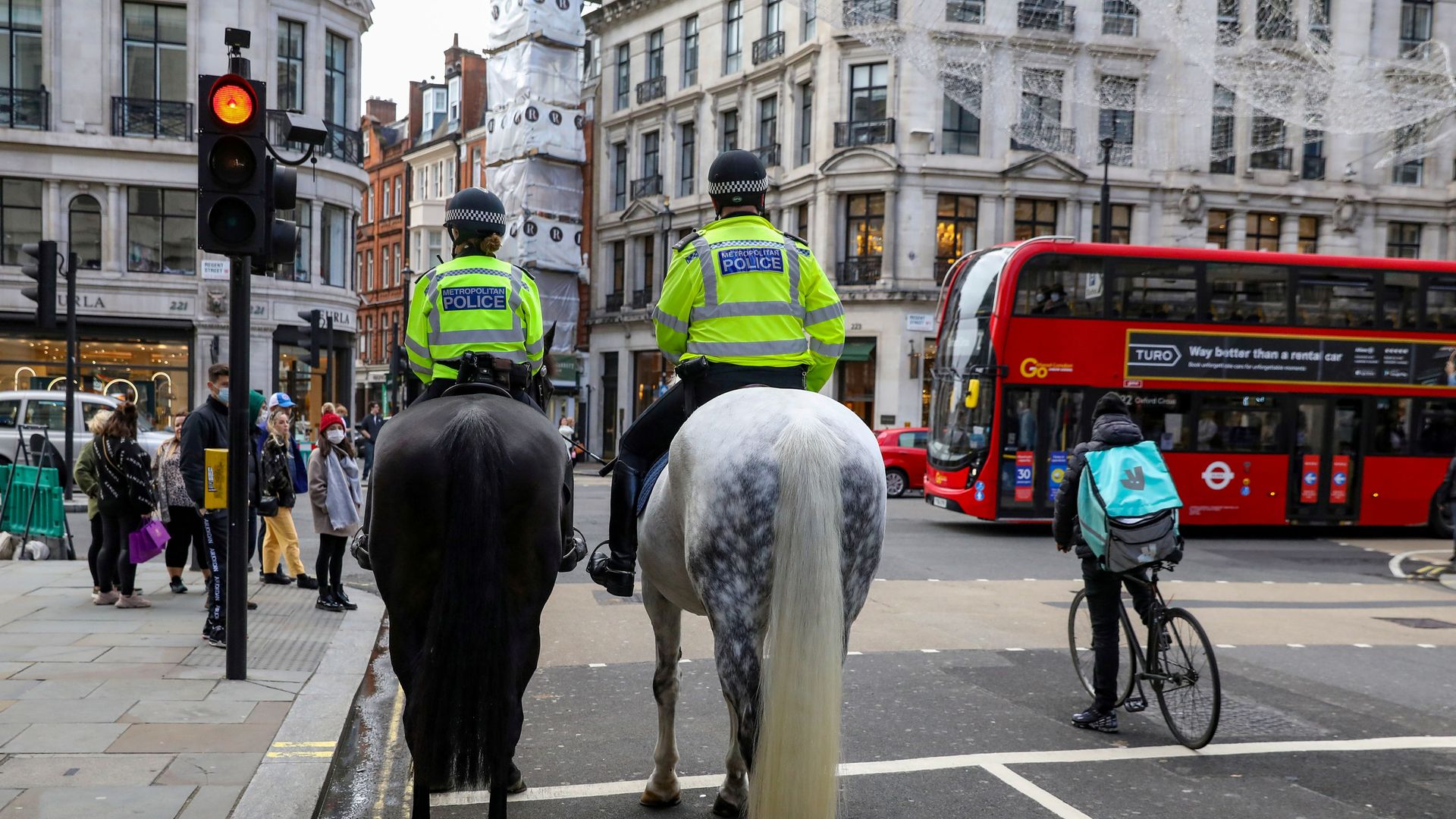 FILE PHOTO: Mounted police and a Deliveroo rider wait at a red light at Regent Street, one of London's main shopping streets, a day after a new lockdown was announced during the coronavirus disease (COVID-19) outbreak in London, Britain November 1, 2020 FILE PHOTO: Mounted police and a Deliveroo rider wait at a red light at Regent Street, one of London's main shopping streets, a day after a new lockdown was announced during the coronavirus disease (COVID-19) outbreak in London, Britain November 1, 2020 - Sputnik International, 1920, 04.03.2021