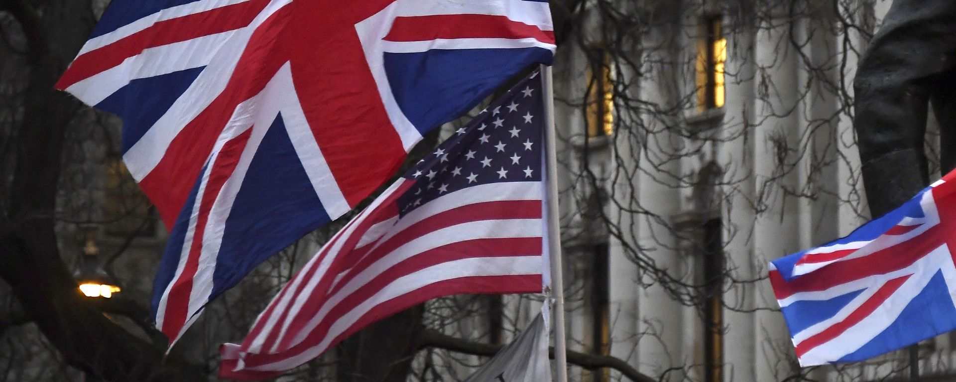 In this file photo dated Friday, Jan. 31, 2020, Brexit supporters hold British and US flags during a rally in London. - Sputnik International, 1920, 04.03.2021