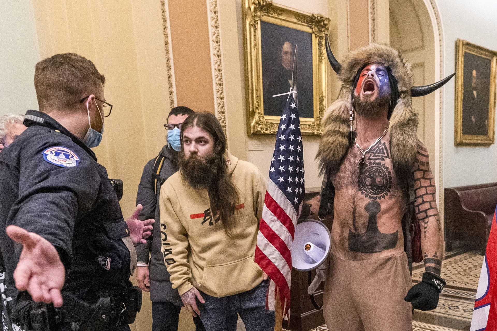 FILE - In this Wednesday, Jan. 6, 2021 file photo, supporters of President Donald Trump, including Jacob Chansley, right with fur hat, are confronted by U.S. Capitol Police officers outside the Senate Chamber inside the Capitol in Washington. Congress is set to hear from former security officials about what went wrong at the U.S. Capitol on Jan. 6. That's when when a violent mob laid siege to the Capitol and interrupted the counting of electoral votes. Three of the four testifying Tuesday resigned under pressure immediately after the attack, including the former head of the Capitol Police. FILE - In this Wednesday, Jan. 6, 2021 file photo, supporters of President Donald Trump, including Jacob Chansley, right with fur hat, are confronted by U.S. Capitol Police officers outside the Senate Chamber inside the Capitol in Washington. Congress is set to hear from former security officials about what went wrong at the U.S. Capitol on Jan. 6. That's when when a violent mob laid siege to the Capitol and interrupted the counting of electoral votes. Three of the four testifying Tuesday resigned under pressure immediately after the attack, including the former head of the Capitol Police. - Sputnik International, 1920, 07.09.2021