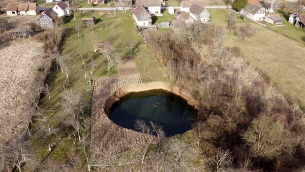 This aerial photo shows a sinkhole in the village of Mececani, central Croatia, Thursday, March 4, 2021 - Sputnik International