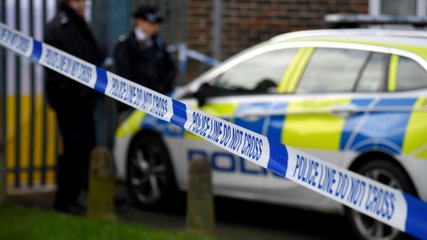 Police officers stand outside the scene of a fatal stabbing as British police said they were investigating at least five separate serious violent incidents in south London late on Friday, Croydon, London, Britain, February 6, 2021 - Sputnik International
