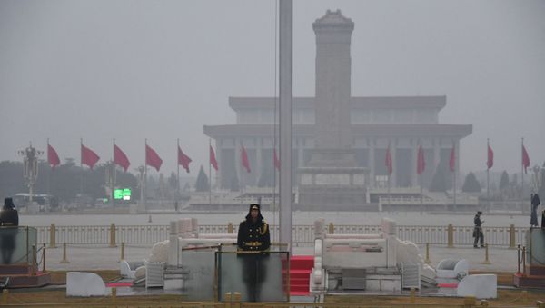 A Chinese soldier stands guard in Tiananmen Square before the opening session of the National People's Congress at the adjacent Great Hall of the People (not pictured) in Beijing on March 5, 2021.  - Sputnik International