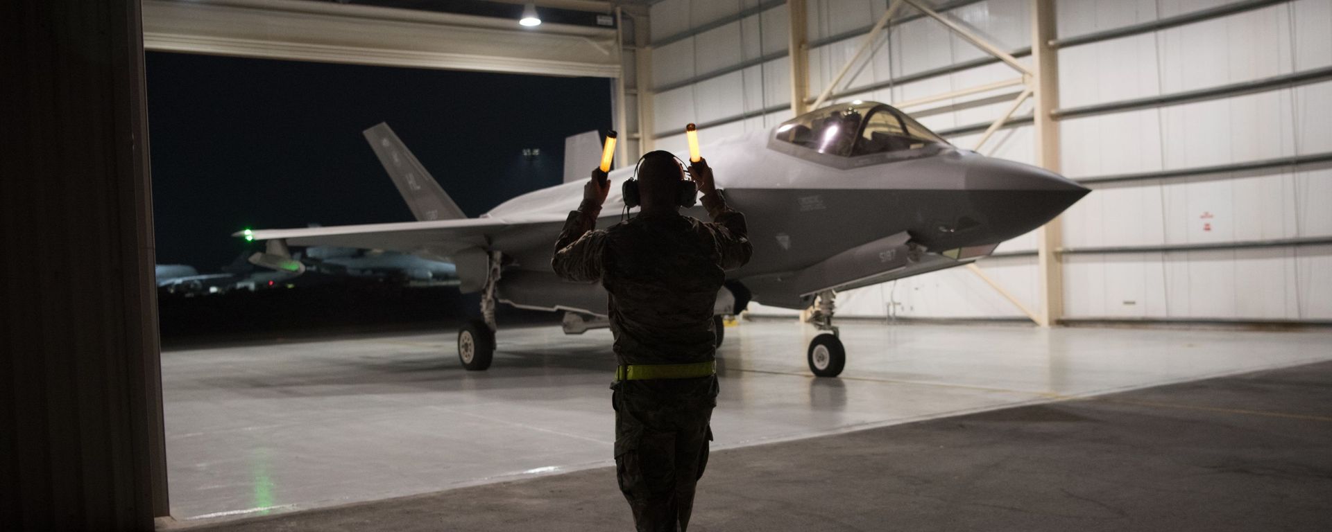 In this Sept. 10, 2019, photo released by the U.S. Air Force, an F-35A Lightning II fighter jet is directed out of a hangar at Al-Dhafra Air Base in the United Arab Emirates. In this Sept. 10, 2019, photo released by the U.S. Air Force, an F-35A Lightning II fighter jet is directed out of a hangar at Al-Dhafra Air Base in the United Arab Emirates. - Sputnik International, 1920, 09.03.2021