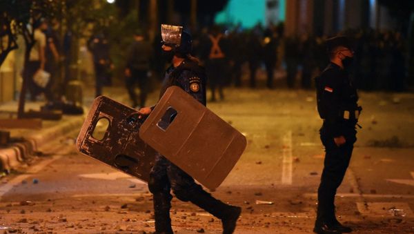 Policemen are seen during clashes with demonstrators following a protest against corruption and lacks in the health system, demanding the resignation of Paraguayan President Mario Abdo Benitez, in Asuncion, on March 5, 2021. - Sputnik International