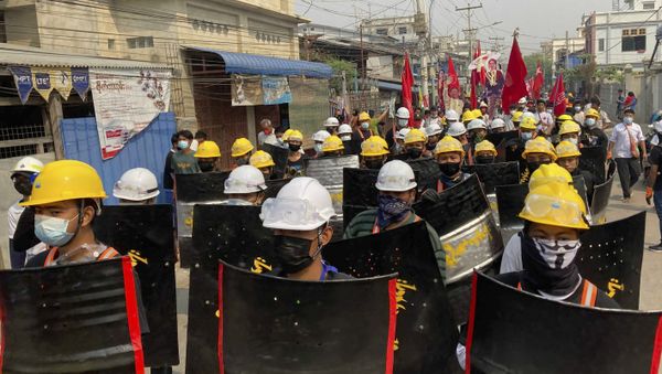 Protesters march with makeshift shields on a main road during a demonstration in Mandalay, Myanmar, Monday, March 8, 2021. Large protests have occurred daily across many cities and towns in Myanmar.  - Sputnik International