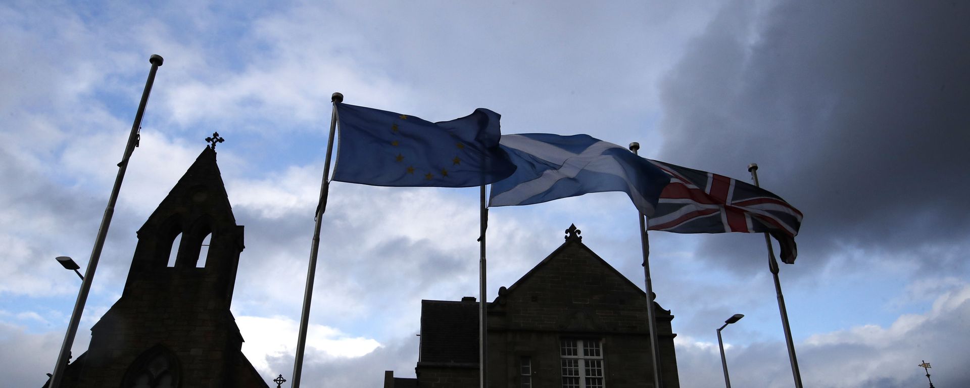 European, Scottish and Great Britain flags float in front of the Scottish Parliament in Edinburgh, Scotland, Wednesday, Sept 4, 2019. The Scottish court says British Prime Minister Boris Johnson's planned suspension of Parliament is lawful. The closely watched decision was revealed Wednesday. It is the first of several challenges to Johnson's maneuver that gives lawmakers little time to prevent Britain from crashing out of the European Union without an agreement on Oct. 31. European, Scottish and Great Britain flags float in front of the Scottish Parliament in Edinburgh, Scotland, Wednesday, Sept 4, 2019. The Scottish court says British Prime Minister Boris Johnson's planned suspension of Parliament is lawful. The closely watched decision was revealed Wednesday. It is the first of several challenges to Johnson's maneuver that gives lawmakers little time to prevent Britain from crashing out of the European Union without an agreement on Oct. 31. - Sputnik International, 1920, 16.01.2023