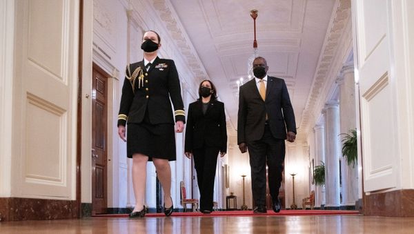 Accompanied by a military escort, U.S. Vice President Kamala Harris walks beside Secretary of Defense Lloyd J. Austin into the East Room, ahead of U.S. President Joe Biden's remarks on International Women's Day at the White House in Washington, U.S., March 8, 2021.  - Sputnik International