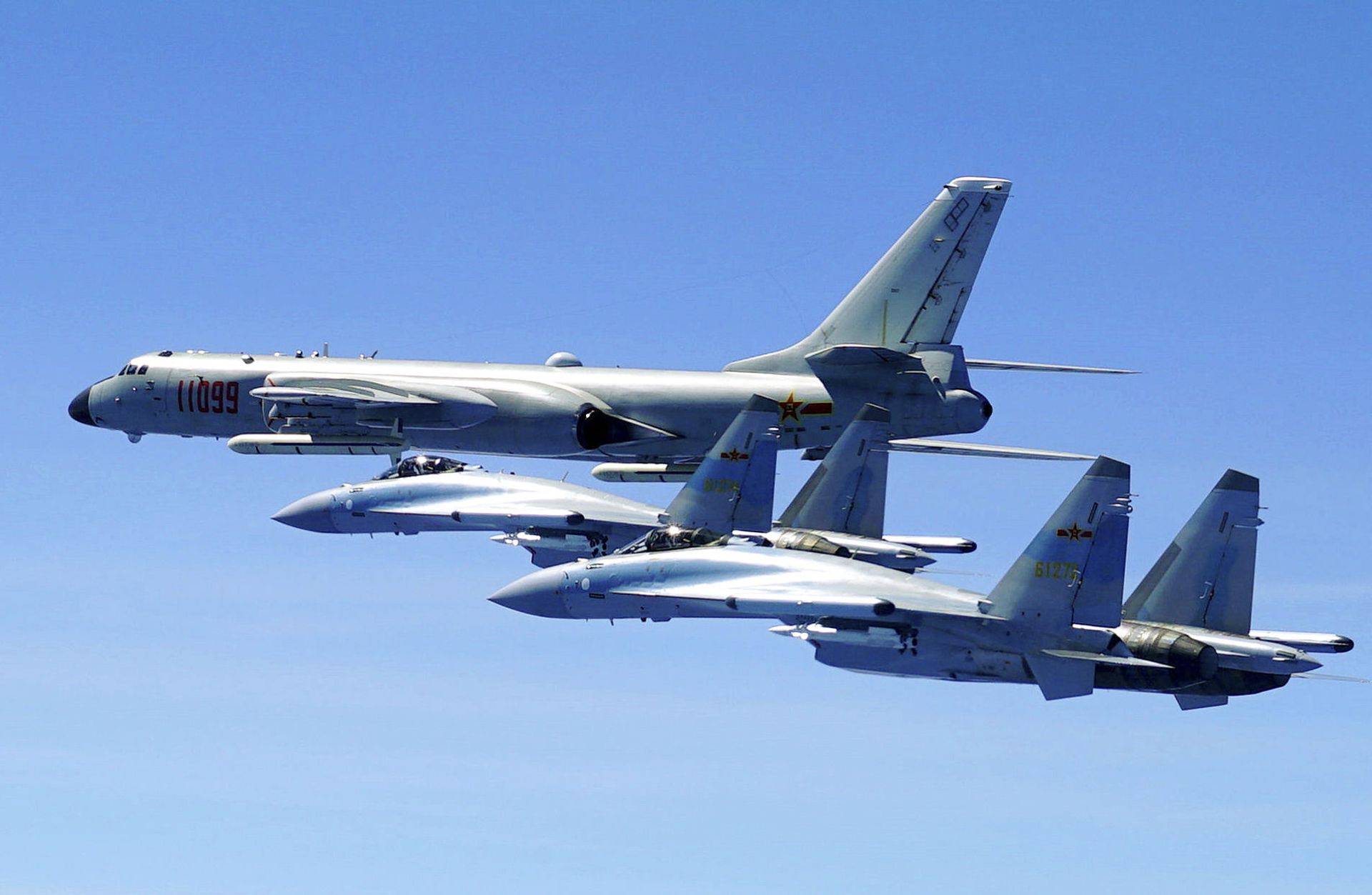 In this photo released by Xinhua News Agency and taken Friday, May 11, 2018, two Su-35 fighter jets and a H-6K bomber from the People's Liberation Army air force fly in formation during patrol that included the Luzon Straits also known as Bashi Straits near Taiwan In this photo released by Xinhua News Agency and taken Friday, May 11, 2018, two Su-35 fighter jets and a H-6K bomber from the People's Liberation Army air force fly in formation during patrol that included the Luzon Straits also known as Bashi Straits near Taiwan - Sputnik International, 1920, 07.09.2021