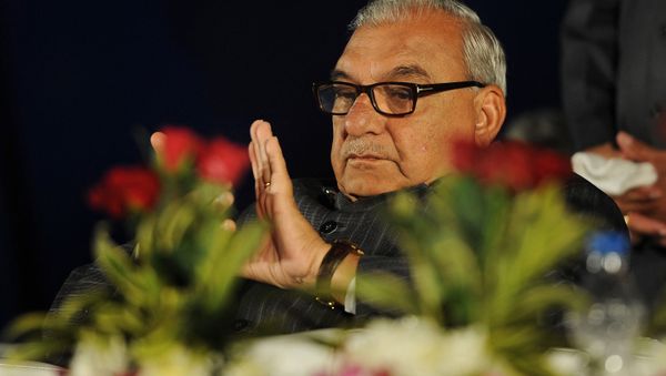 Chief minister of Haryana Bhupinder Singh Hooda looks on during the inauguration of Panasonic 'eco ideas' factory at Jhajjar in Haryana on December 12, 2012 - Sputnik International