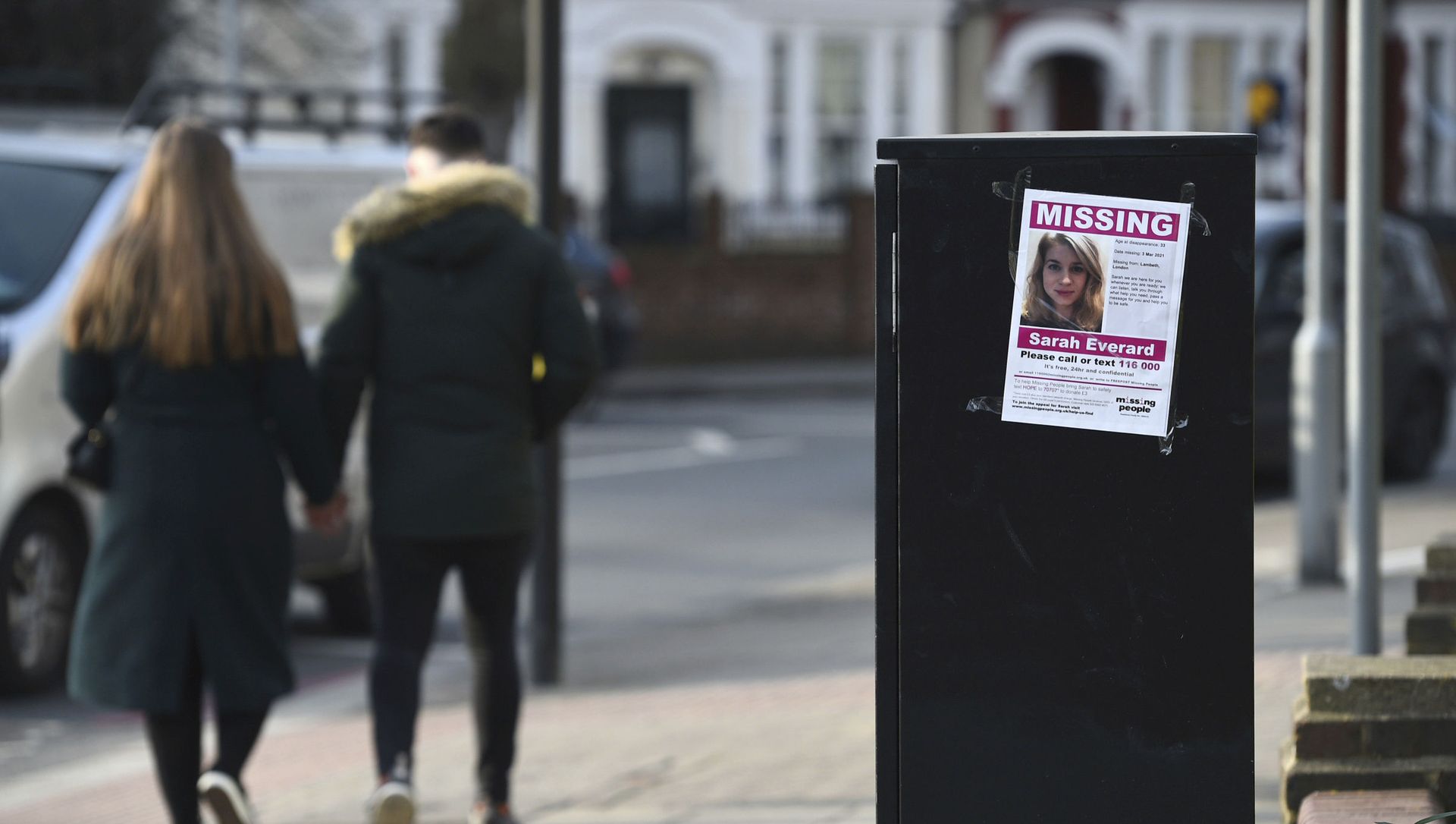A couple walk past a poster in south London appealing for help in finding missing Sarah Everard A couple walk past a poster in south London appealing for help in finding missing Sarah Everard - Sputnik International, 1920, 12.03.2021