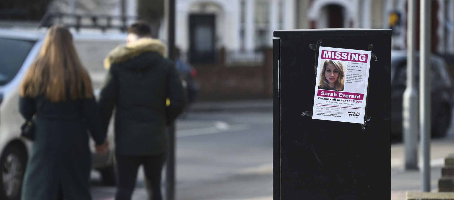 A couple walk past a poster in south London appealing for help in finding missing Sarah Everard A couple walk past a poster in south London appealing for help in finding missing Sarah Everard - Sputnik International, 1920, 11.03.2021
